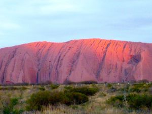 Finding a moment: After a socked in day of clouds, the sun peeks out just in time to do its magic with Uluru. You could sense the Dreamtime at work.  