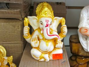 white and gold ganesha