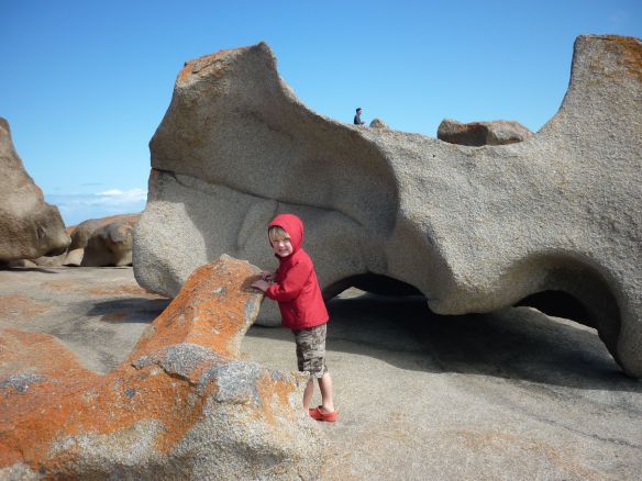 The rock behind Eddie almost looks like a dinosaur bone. At the Remarkable Rocks, Kangaroo Island, SA
