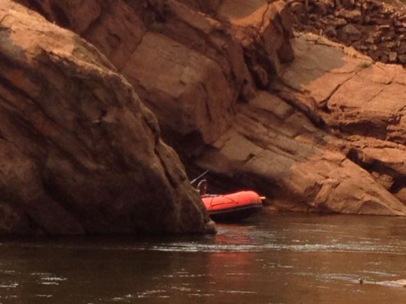 A raft emerges from around the corner of granite rocks along the canyon of Fremont Co., Colorado (2013)