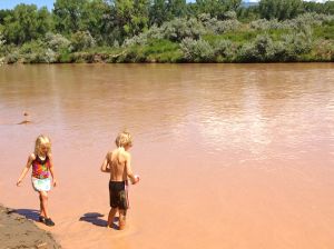 Kasey and Eddie play in the melted Frappuccino water.  