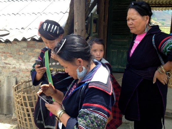 Li takes a rare break from our trek and checks her cell phone.