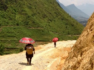 Hmong women with umbrellas