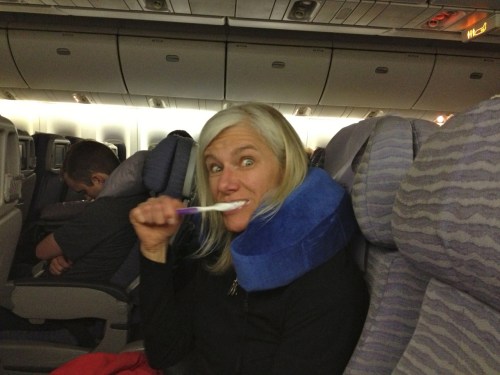 Steph brushing teeth on China Airlines flight 2
