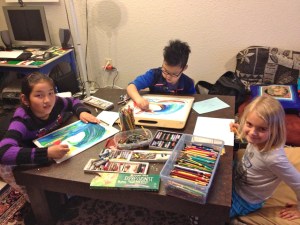 Tsogo's art students and Kasey work on their creations. 